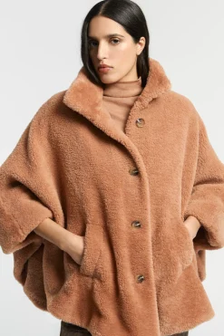 Zachte poncho in teddystof